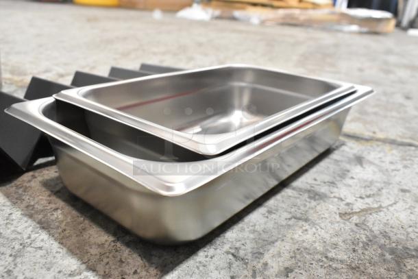Stainless steel drop-in bins, brand new with minor scratches and dents, includes metal holder, enhancing durability.