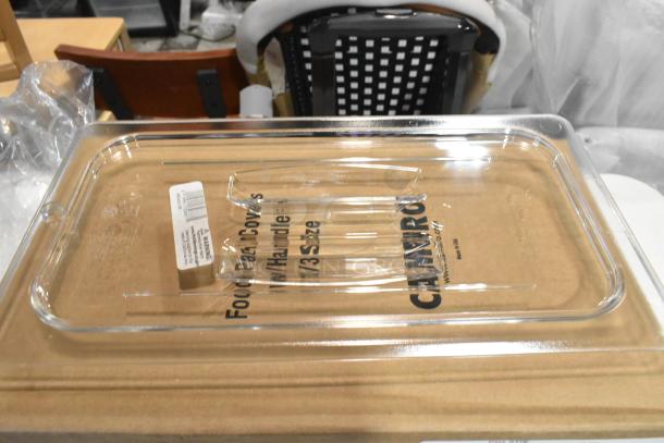 BRAND NEW Cambro 30CWCH135 Camwear® 1/3 Size Clear Polycarbonate Handled Lid, scratch and dent, with barcode label visible.