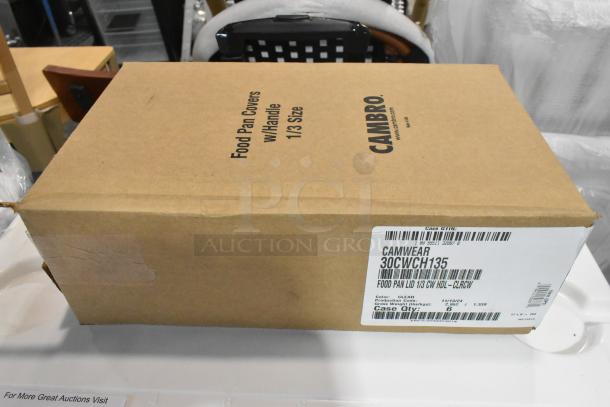 Brand new Cambro Camwear 1/3 size clear polycarbonate handled lid, model 30CWCH135, in original packaging.