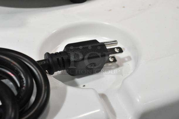 Close-up of a power plug from the APW Wyott RW-1V 7 Qt. Round Warmer, brand new with minor scratches, 120V, 1 Phase.