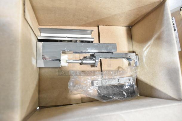 Three new Kason items in a box: 1467-R00014 hinge, 1346-000005 hinge, and 11808FMA100 LED fixture, 120V, 12W, 4000K.