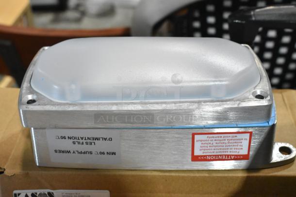 Kason 11808FMA100 LED fixture, 120V, 12W, 4000K, brand new, aluminum casing, visible label with installation instructions.