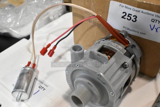 Brand new Noble Warewashing rinse pump, model 4952975139, for HT-UC24, HT-DT51, HT-DT513. Auction tag shows 2 items.