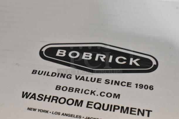 Box for Bobrick B-8876 Polished Nickel Automatic Faucet, scratch and dent condition, unopened, part of washroom equipment.