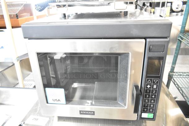 Brand new Amana RC22S2 stainless steel commercial microwave oven with push button controls, 208/240V, scratch and dent.