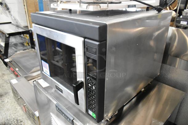Stainless steel Amana RC22S2 commercial microwave with push-button controls, brand new scratch and dent, 208/240V, 1 Phase.
