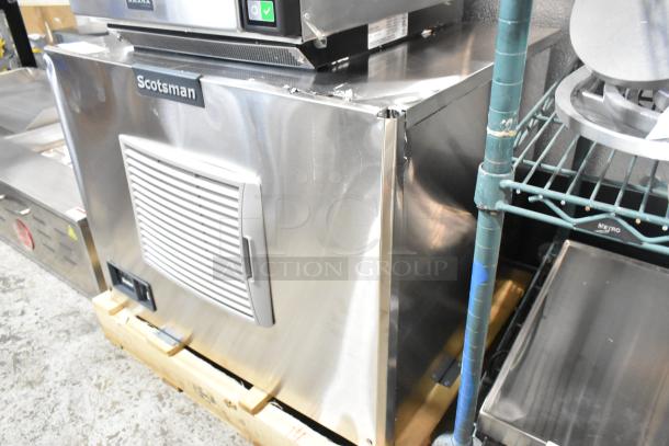Brand new Scotsman MC0330SA-1A ice machine, stainless steel, 30", with visible scratches and dents, 400 lb capacity, 115V.