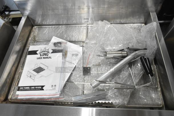 Brand new Carnival King 382DFCG32N stainless steel fryer with accessories. Includes user manual, 40 lb. capacity, 75,000 BTU.