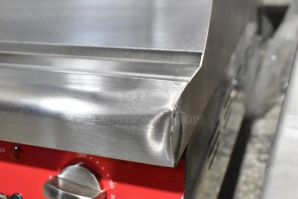 Stainless steel Avantco 177EG30N 30" electric griddle with visible dent, new condition, 208/240V, 1 phase.