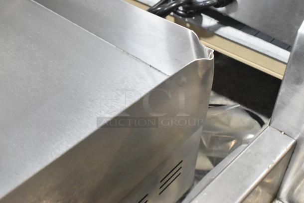Brand new Avantco 177EG30N stainless steel 30" electric countertop griddle. Features visible dent. 208/240V, 1 phase.