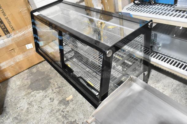 Brand new Avantco 360BCSS48HCB 48" black refrigerated bakery display case. Features LED lighting and broken glass. 120V, 1 phase.