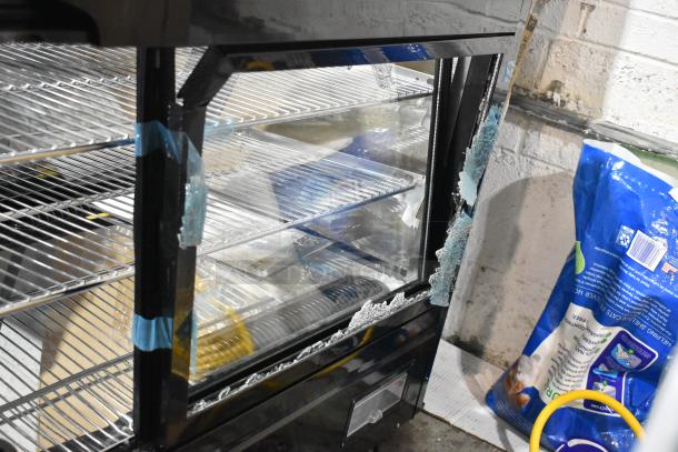 Avantco 360BCSS48HCB 48" black refrigerated countertop bakery display case, broken glass shown, LED lighting, 120V, 1 phase.