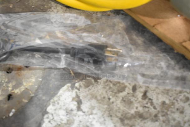 Electrical plug wrapped in plastic on concrete surface, related to Avantco 360BCSS48HCB display case.