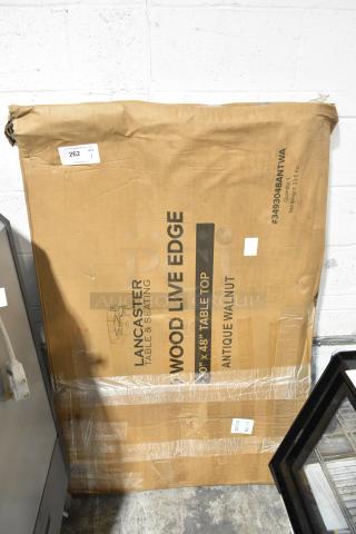 Brand new Lancaster 30"x48" live edge table top in rustic walnut. Scratch and dent; in original packaging. Model #3493048ANTWA.