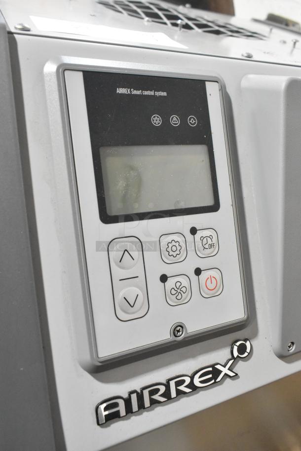 BRAND NEW Airrex AHSC-18P 1.5 Ton Portable Heat Pump. Control panel with buttons visible. Scratch and dent condition.