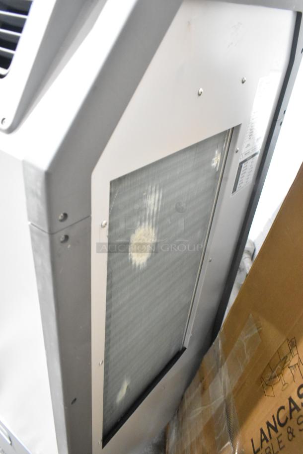 Brand new Airrex AHSC-18P 1.5 Ton portable air-cooled heat pump with visible dents. 16,800 BTU, 115V, 1 phase.