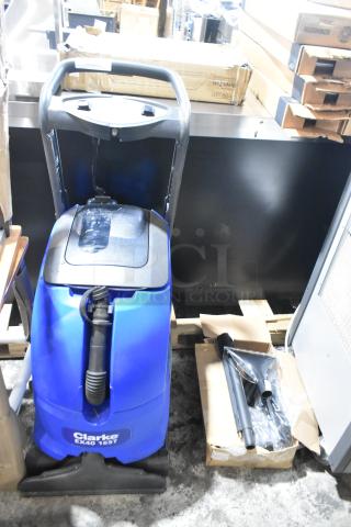 Brand new Clarke EX40 16ST 16" Corded Carpet Extractor, 7-gallon. Visible scratches and dents, accessories included.
