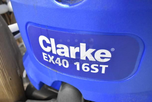 Clarke EX40 16ST carpet extractor, new scratch and dent condition, 16" cleaning path, 7-gallon capacity, visible branding.