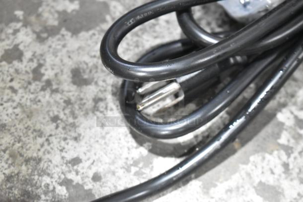 Close-up of a power cord for the 2023 Avantco 360CPT80 Stainless Steel 80" Refrigerated Prep Rail.