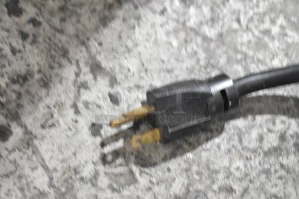 Close-up of a power plug for a Bunn SINGLE SH DBC BrewWISE coffee brewer. Plug shows typical wear marks.