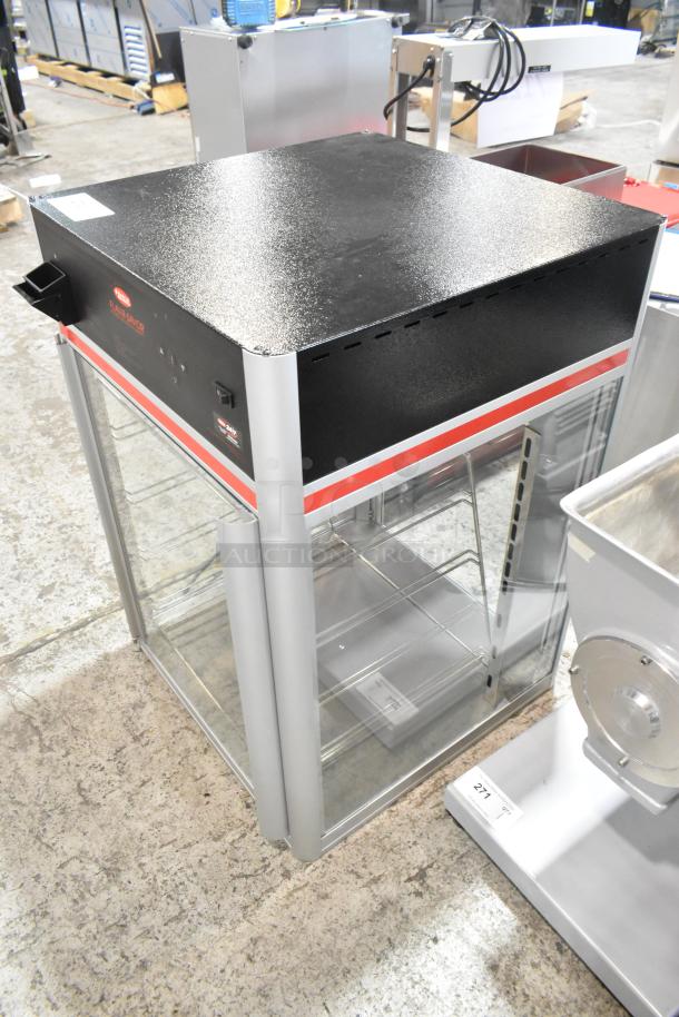 Brand new Hatco Flav-R-Savor FSDT-2X display cabinet. Two doors, four-tier pan rack, 120V, 1 phase. Scratch and dent.