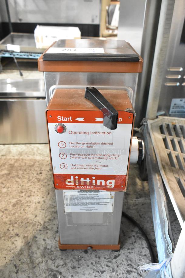 Ditting KFA 903 metal commercial coffee grinder, countertop model, 120V, 1 phase. Visible instructions and branding.