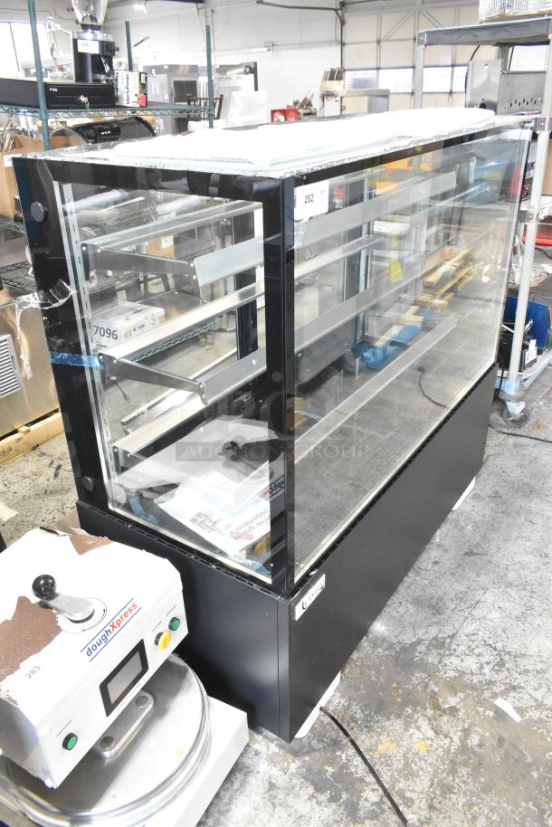 Brand new Avantco 193BCF60B refrigerated bakery display case, metal, 59 1/8", black, with top glass damage visible.