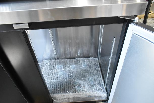 Brand new Continental BB90SN back bar refrigerator, black, 90", shallow-depth, solid door open, 115V, minor scratches.