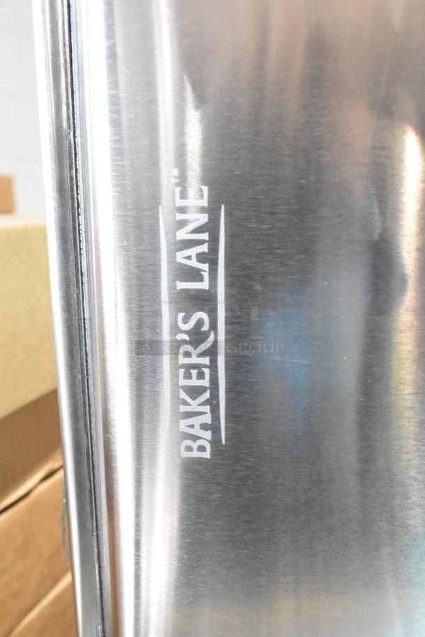 Box of 12 Bakers Mark 407FULL16G full-size 16-gauge aluminum sheet pans, wire rim, 18"x26", slight scratches, new.