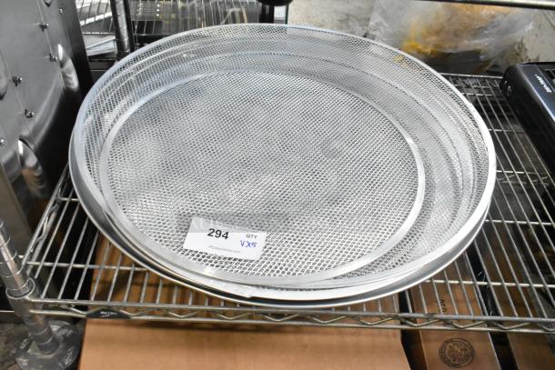 Five brand new metal mesh baking screens on a shelf, each with a round metal pan. Label indicates lot 294, quantity 5.