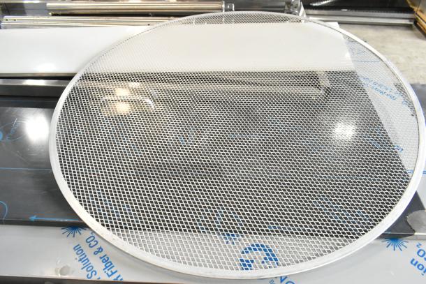 Metal mesh baking screen, round with a fine grid pattern, in new scratch and dent condition, part of a mixed lot of 5 items.