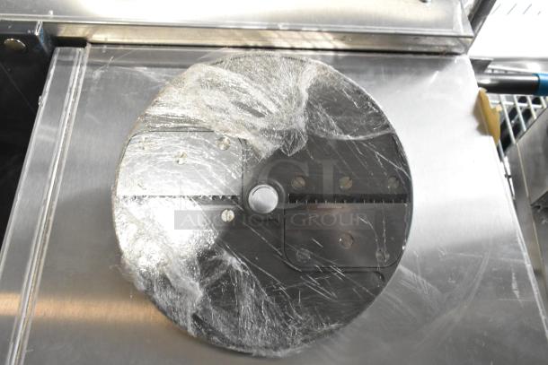 Two vegetable slicer blades and one Robot Coupe food processor blade, brand new condition, wrapped in plastic.