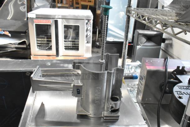 Brand new Garde vegetable slicer with metal collar; scratch and dent condition. Auction includes three items.