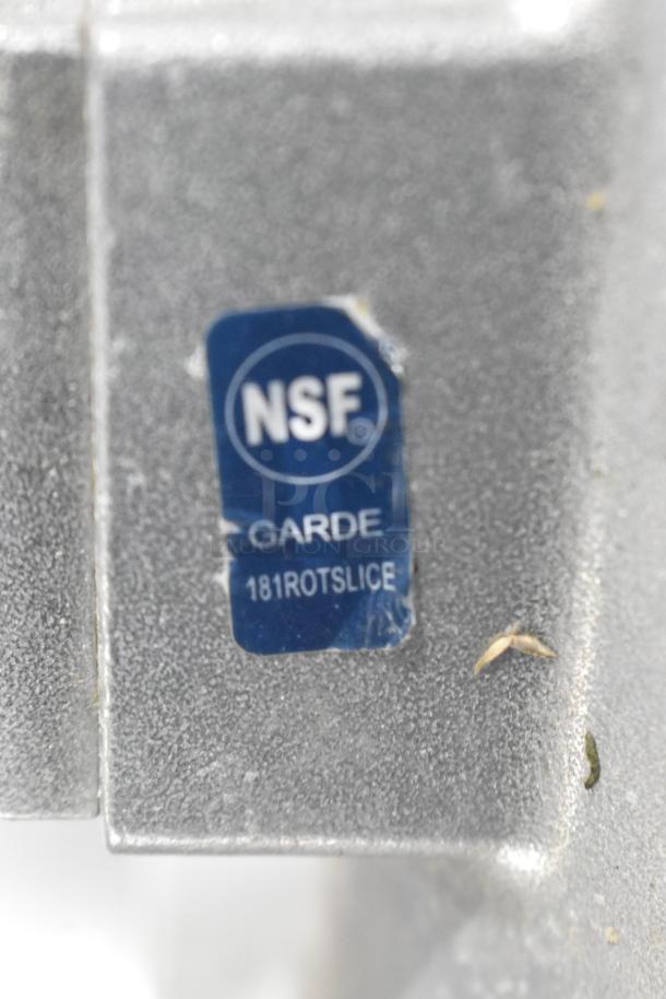 NSF-certified metal part for Garde vegetable slicer, model 181ROTSLICE, with visible scratches and dents.