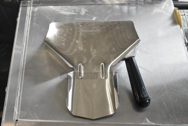 7 brand new Pro-ware stainless steel fry scoopers, scratch and dent condition, with black handles.
