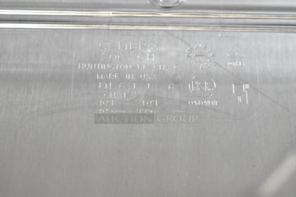 "Close-up of Cambro 20CWCH135 clear polycarbonate lid marking, NSF certified, made in USA, 1/2 size, dishwasher safe."