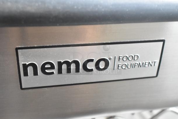 Nemco Ice Cream Dipper Well and Faucet set, brand new with minor dents. Stainless steel finish, Nemco logo visible.