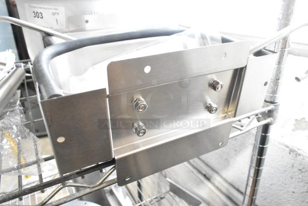 2 brand new Nemco ice cream dipper wells with faucet set, stainless steel, scratch and dent condition, auction tag visible.