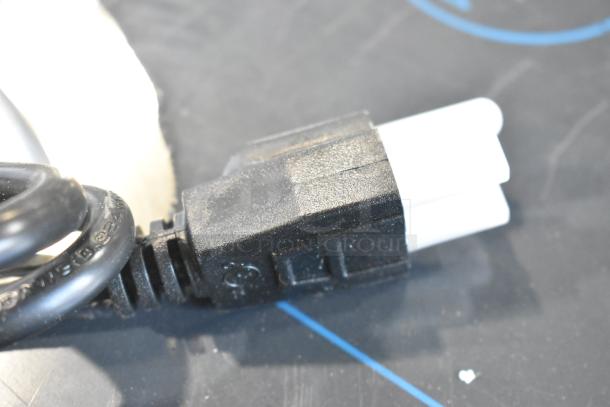 Close-up of power plug for Carnival King 382CDPW3 Triple Cone Dip Warmer. Black and white connector shown.