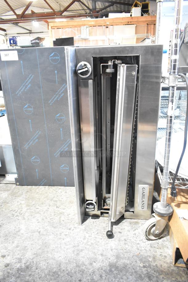 Brand new Garland cheese melter, stainless steel, natural gas, with back splash, slight scratches, commercial grade.