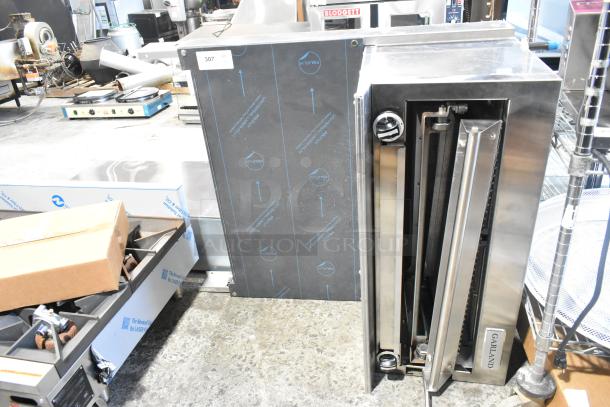 Brand new Garland stainless steel commercial cheese melter, natural gas, with back splash, minor scratches.