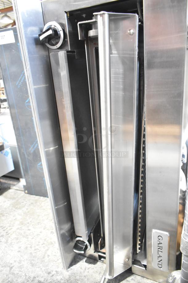 Garland stainless steel cheese melter, brand new scratch and dent, natural gas powered, with back splash.