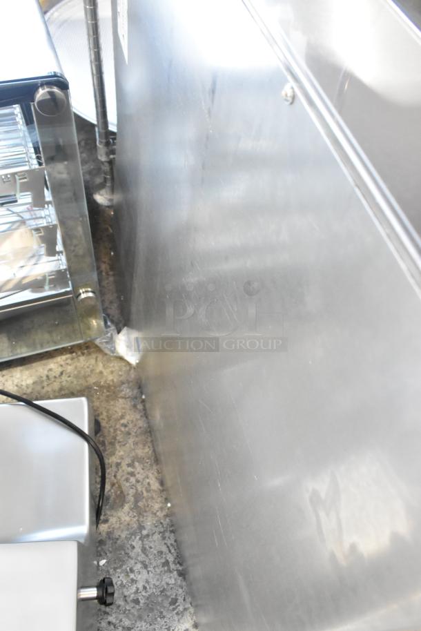 Brand new Garland stainless steel commercial cheese melter with back splash, natural gas powered, scratch and dent condition.