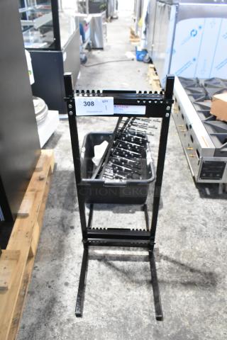 Brand new Garland Jack Stack Master of Space black metal rack, scratch and dent condition, auction tag visible.