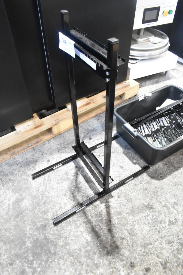 "Brand new Garland Jack Stack Master of Space black metal rack, scratch and dent condition, showing structural components."