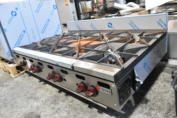 Wolf AHP848-1 stainless steel commercial 8-burner range, natural gas, 240,000 BTU, brand new with scratches and dents.