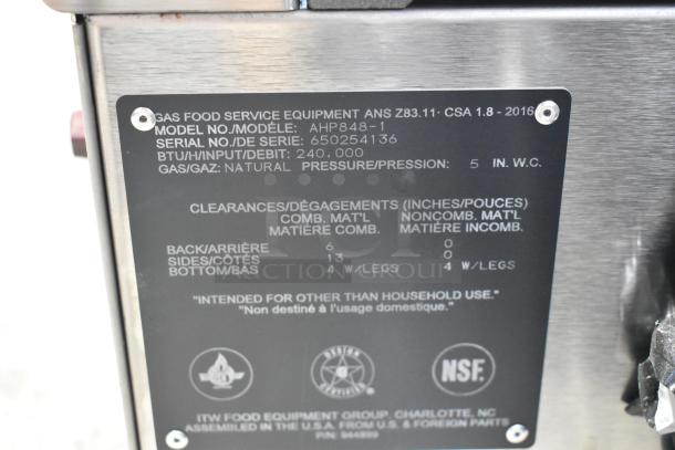 Wolf AHP848-1 stainless steel commercial gas range, 48", 8 burners, 240,000 BTU. Label shows specs and safety standards.