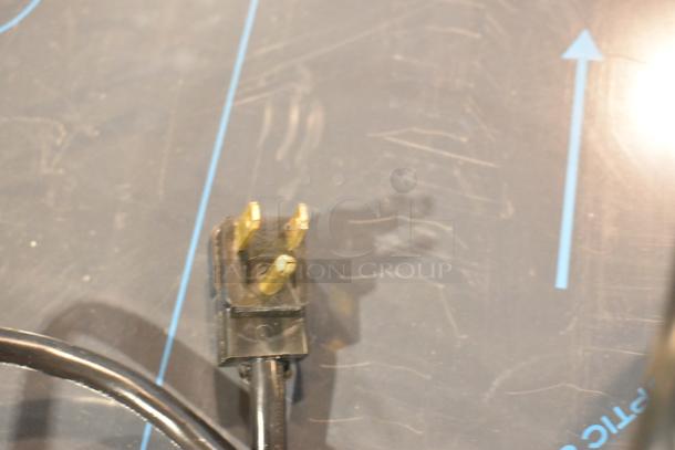 Close-up of a three-prong power plug for the Beverage Air SPE48HC-S refrigerated salad bar, 115 Volts, 1 Phase.