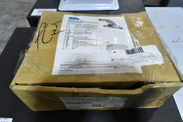 Brand new Zurn Elkay Z6915-XL AquaSense sensor faucet in original damaged box, 4" centers, 6 3/4" spout, .5 GPM, battery-powered.