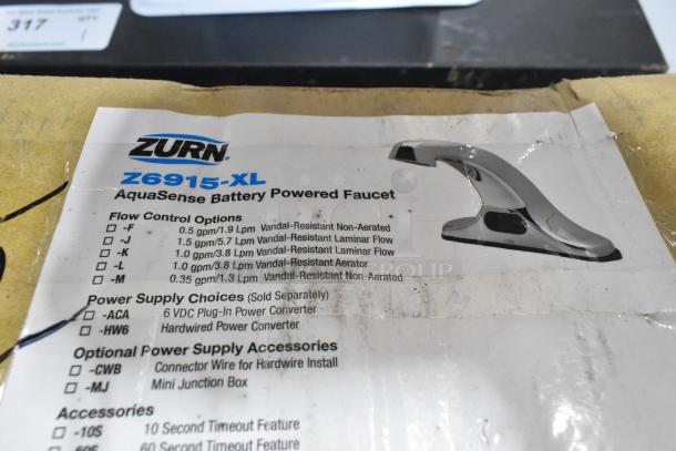 Brand new Zurn Elkay Z6915-XL AquaSense sensor faucet, 4" centers, 6.75" spout, battery-powered, minor scratches and dents.